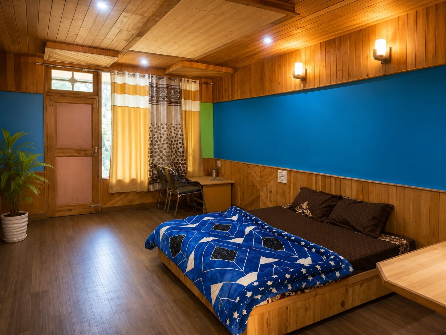 Bedroom with blue bedding at Sunset Homestay